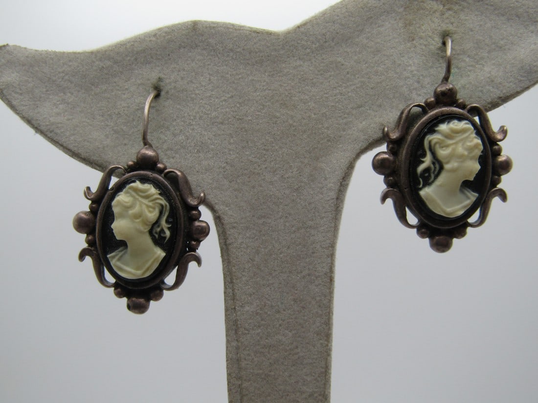 Vintage Sterling Cameo earrings, Hook Posts, 1970's-1980's, Signed: Vintage Sterling Cameo earrings, Hook Posts, 1970's-1980's, Black & White Cameo that is a molded design and set in a bezel. Signed M and marked .925 and test as sterling with a weight of appx. 7.19 gr