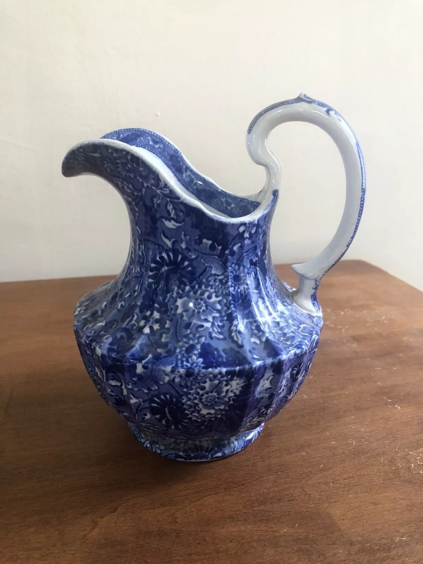 Flow Blue Pitcher: It is 7 1/4” high and is marked. It has no chips, cracks or repairs Shipping: Domestic: Flat-rate of $15.00 to anywhere within the contiguous U.S. International: Foreign shipping rates are deter