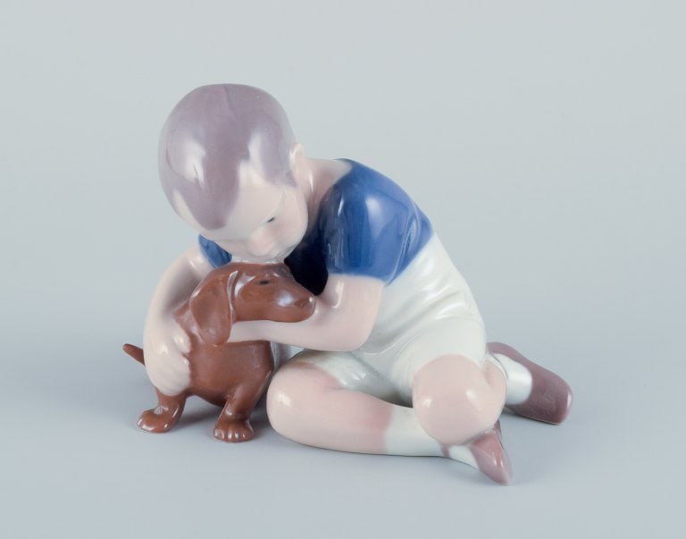 Ingeborg Plockross Irminger for Bing & Grøndahl, porcelain figurine of a boy with a dachshund. (1 of 5)