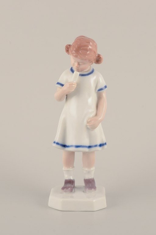 Bing & Grøndahl, Denmark. Rare porcelain figurine. Young girl with ice cream.: Bing & Grøndahl, Denmark. Rare porcelain figurine. Young girl with ice cream. Mid-20th century. Marked. First factory quality. In perfect condition. Dimensions: Height 18.5 cm. x Diameter 6.2 cm.