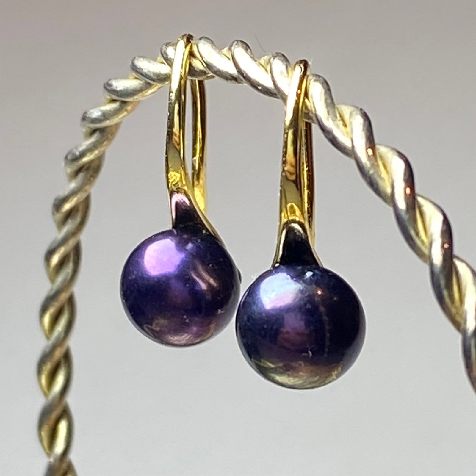 Tahitian Peacock Blue Pearl 18k Gold Vermeil Earrings: Title: Tahitian Peacock Blue Pearl 18k Gold Vermeil Earrings Description: This is a stunning pair of Tahitian Peacock Blue Pearl Earrings, featuring lustrous, iridescent pearls from the azure waters o