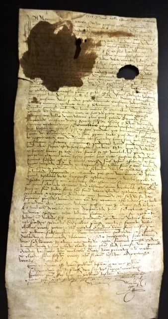 1502 French Vellum Manuscript: Legal manuscript in French dated 1502 on heavy vellum regarding a Claude Bruni. Some damage to top portion including foxing. Measures 8 x 18". Reserve: $40.00 Shipping: Domestic: Flat-rate of $8.00 to
