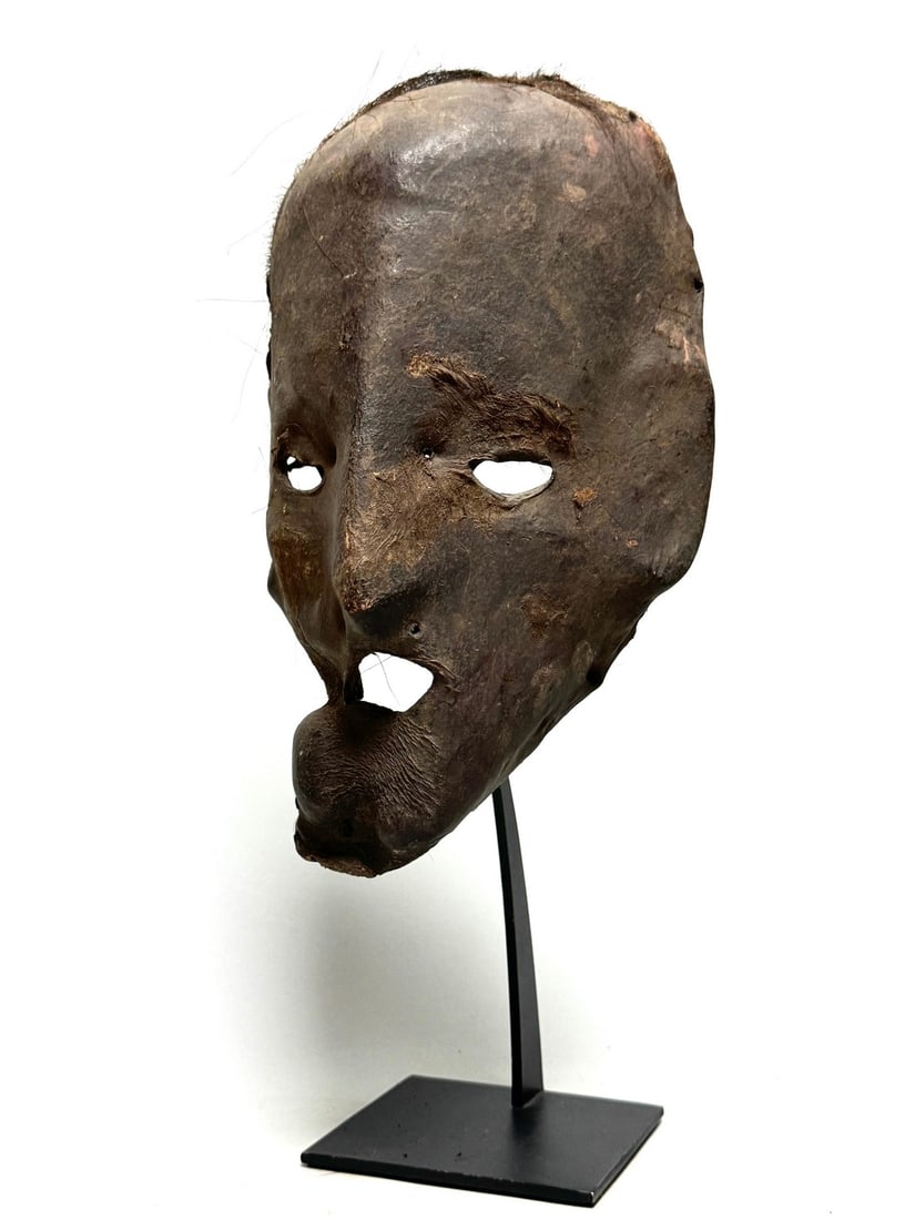 Shaman yak mask - Himalayas - Nepal: Shaman mask from the Himalayas in Nepal. This mask is made of yak leather. These masks are made traditionally by first processing wood into the desired shape. The wood is then rubbed with yak butter, 