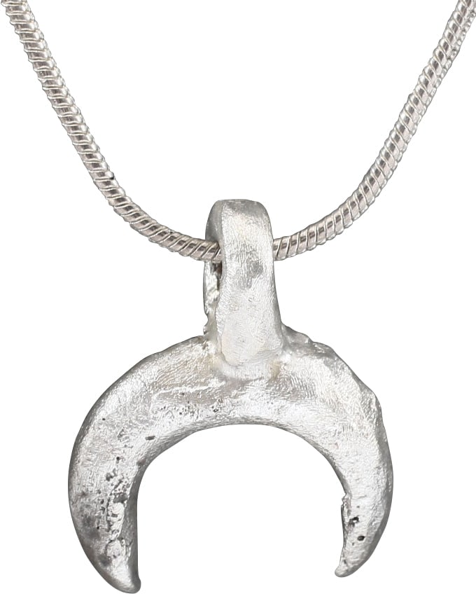VIKING LUNAR PENDANT NECKLACE C.950-1050 AD: Just over 5/8" width. As expert navigators, the constellations signified mystery and power to Vikings. The Moon was personified as Mani, brother to Sol the Sun, and is abundantly represented in Norse 