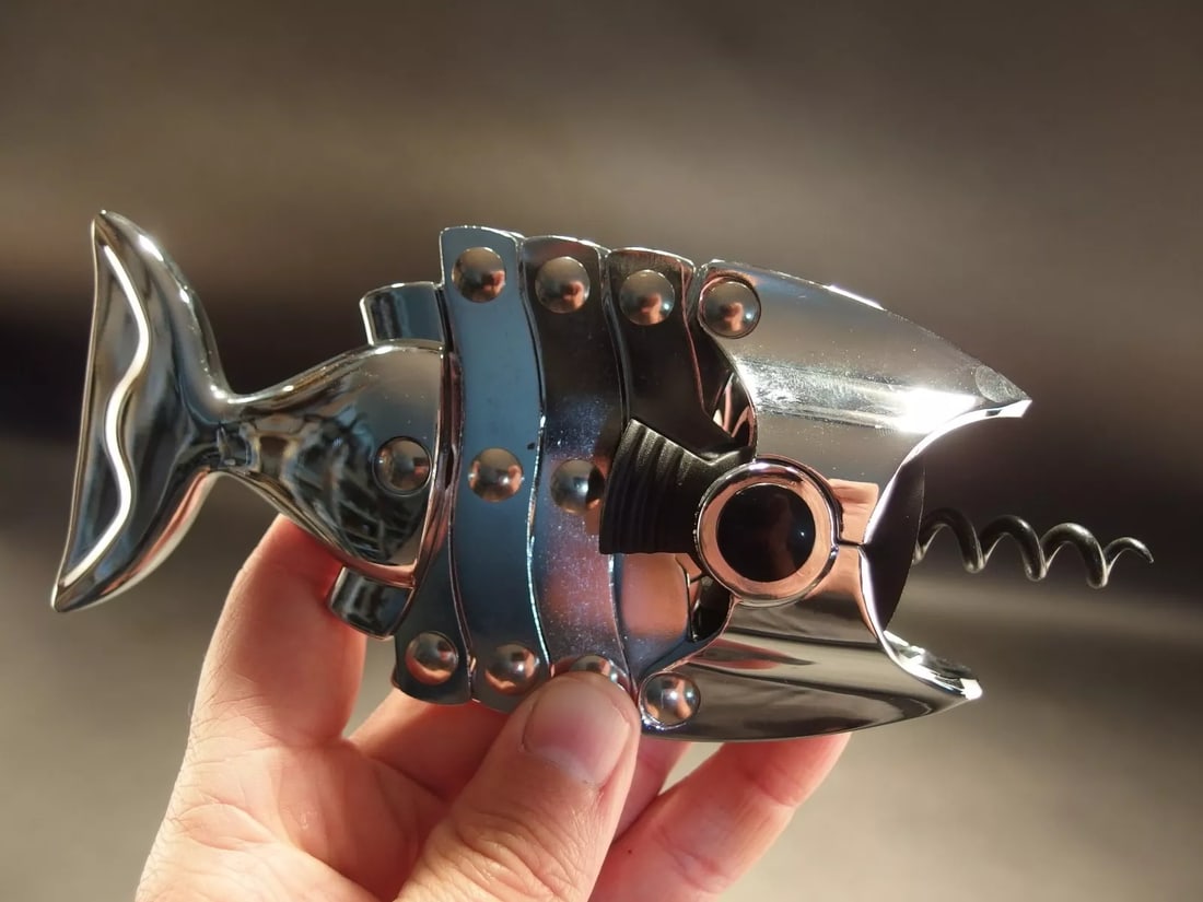 Fish Shaped Wine Bottle Corkscrew Opener: 6 3/4" Long Closed x 3" Wide Such a neat vintage style fish shaped multi lever cork screw. The riveted levers assist in pulling the cork out. Great for use or display! Reserve: $25.00 Shipping: Domest