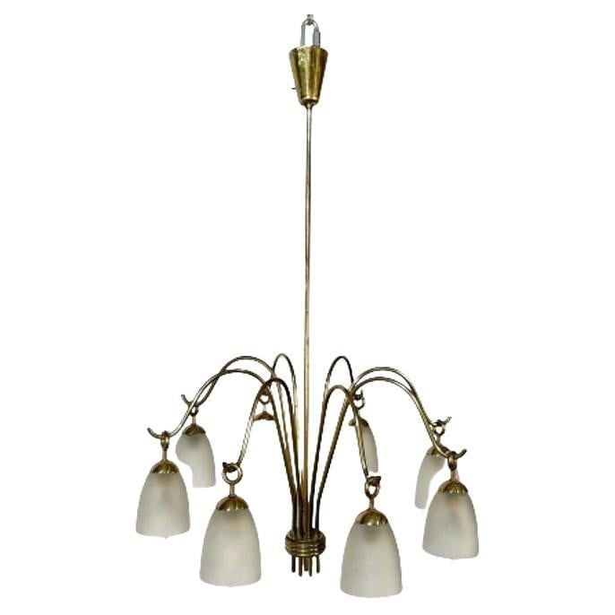 Italian Mid-Century Modern Arredoluce Eight Arm Brass Chandelier by Angelo Lelli: About the Item Italian Mid-Century Modern Arredoluce Eight Arm Brass Chandelier by Angelo Lelli Modern brass chandelier designed by Angelo Lelli for Arredoluce in Italy, c. 1960s. Brass, Glass Italy,
