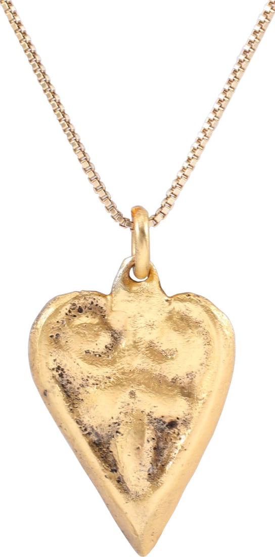 VIKING HEART PENDANT NECKLACE, C.950-1050 AD: Just over 7/8" height (0.92"), plus the loop. The Viking heart in its fully developed form with a cusp top formed by the terminals of the broad borders. The center with an elaborate pentafoil (foliate