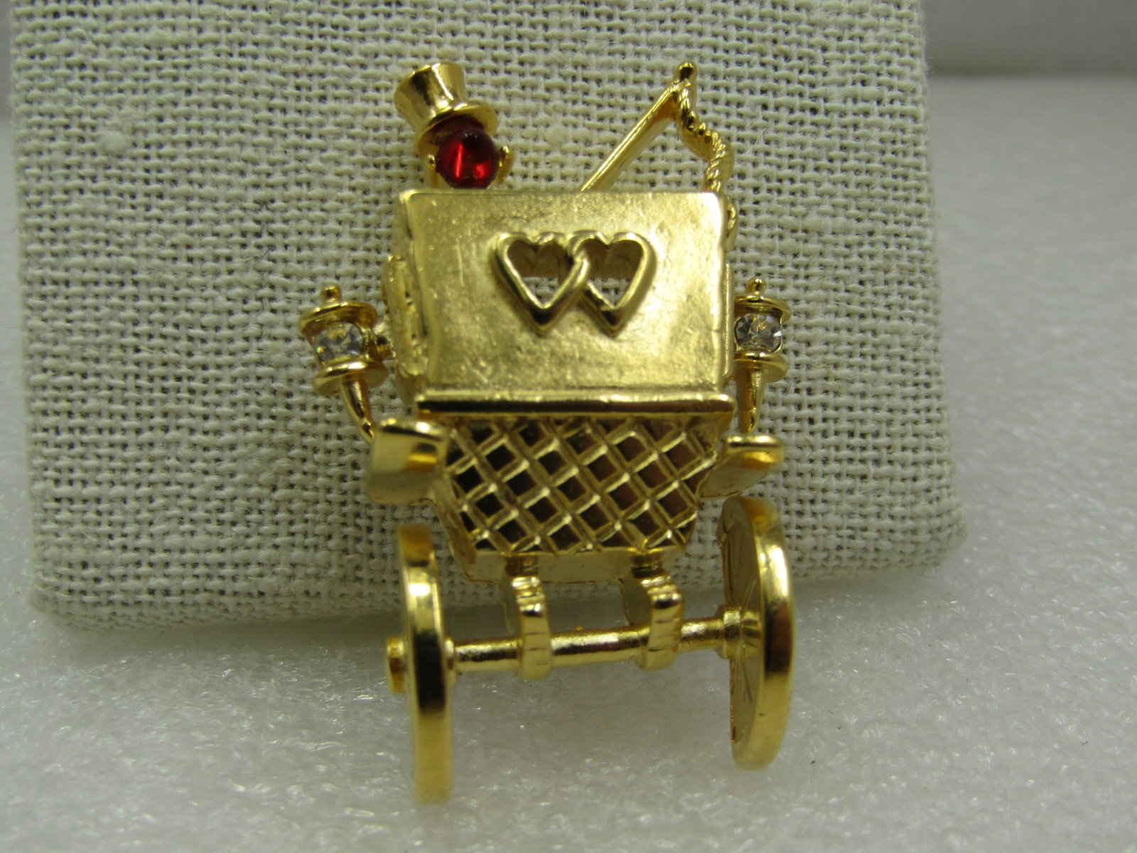 Vintage Trifari Honeymoon Horse Carriage Brooch, Heart Windows in Original Box: Vintage Trifari Honeymoon Horse Carriage Brooch, Heart Windows in Original Box. Rearview of a horse carriage with cutout heart windows, lantern on each side and driver with a red rhinestone head and w