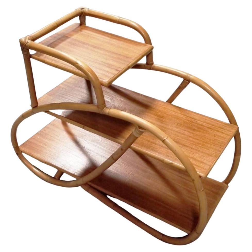 Restored Rattan 3-Tiered Single-Strand 3/4 Pretzel Arms Side Table: About the Item Rattan side table 3-tier of shelves with 1 strand 3/4 pretzel rattan arms. Perfect alongside your bed or sofa. Circa 1950, USA We only purchase and sell only the best and finest rattan