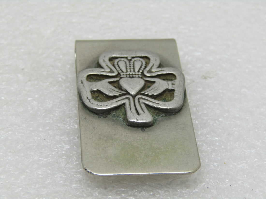 Vintage Stainless Steel and Pewter Claddagh Money Clip. Circa 1960's.: Vintage Stainless Steel and Pewter Claddagh Money Clip. Circa 1960's. The traditional Irish Chladaigh hands and heart with the crown above, representing love loyalty and friendship, are enclosed in an