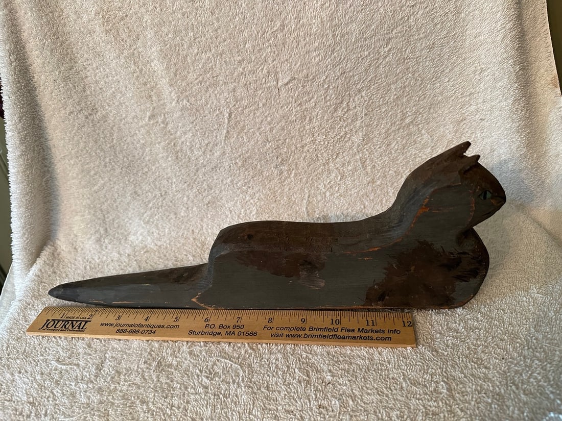 Whimsical Cat Form Dibble Stick: Dibble sticks are pointed sticks use by farmers when they plant seeds by hand: the pointed end makes a hole of desired depth so that a seed/seeds can be dropped in. Something they were even whimsical.