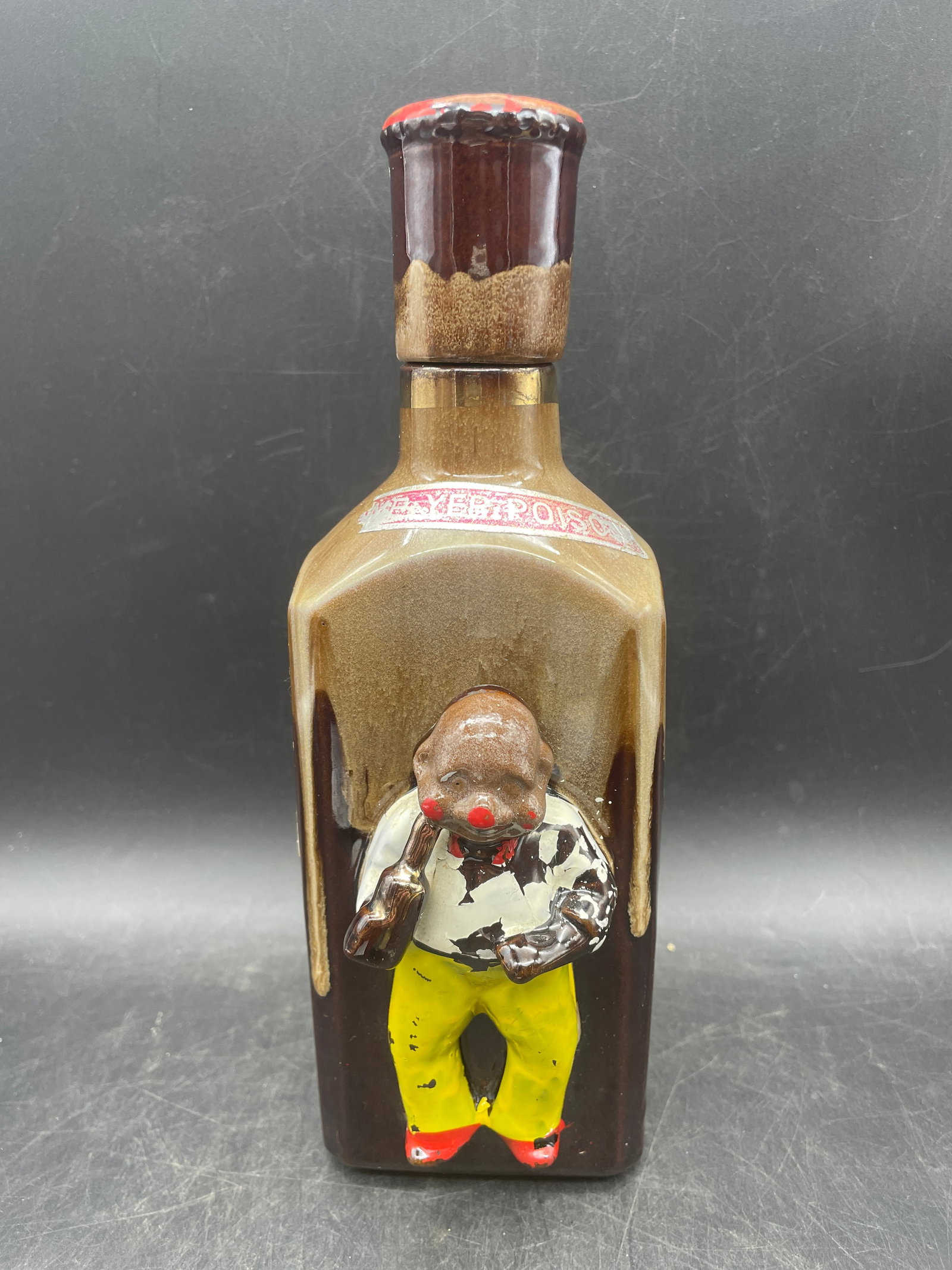 RARE 1950S BLACK AMERICANA EL STINKO JUNGLE JUICE DECANTER W/ ORIGINAL CORK TOP: Title: RARE 1950S BLACK AMERICANA EL STINKO JUNGLE JUICE DECANTER W/ ORIGINAL CORK TOP Date/Period: approx 1950's Dimension: approx 9 x 3 x 2 Material: CERAMIC Additional Information: RARE 1950S BLACK