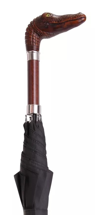 Gator Head Umbrella: This Italian handcrafted umbrella features a sturdy gator head handle and a black canopy on a self-opening 25 x 8 frame, with a sheath for convenient storage. Built to last. Reserve: $90.00 Shipping: 