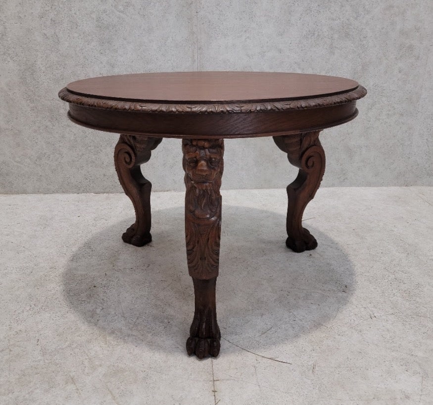 Antique French Carved Figural Oak Entry Table: Antique French Carved Figural Oak Entry Table An antique French finely carved oak table with 3 winged lions-head legs with pawed feet. Circa Early 20th Century Dimensions: H 28" D 37.5" Great Vintage