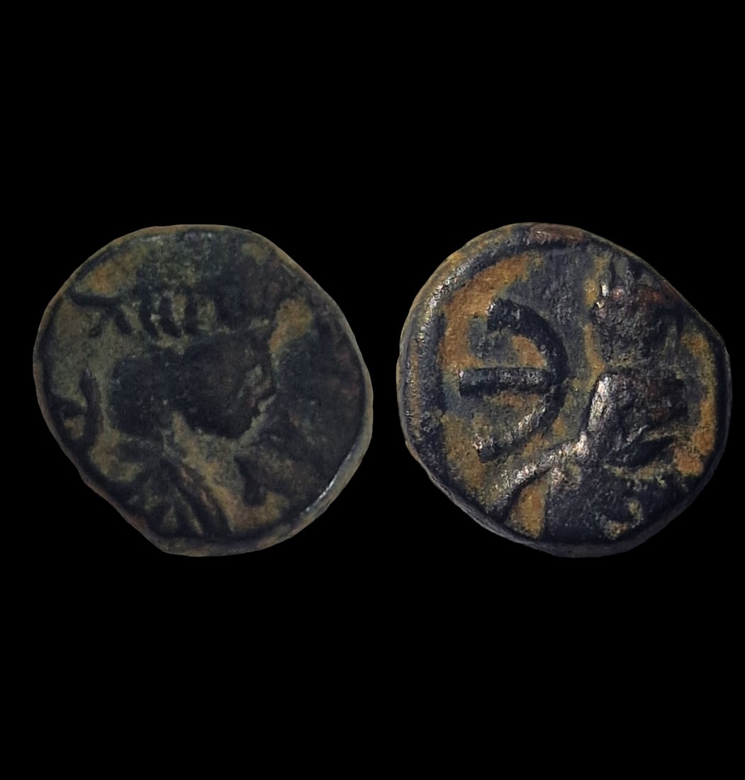 The Byzantine Empire: Title: The Byzantine Empire Description: Justin I AE pentanummium, Tyche on Antioch seated in shrine Date/Period: 518-527 AD Materials: bronz coin Dimensions: 11.6 mm Reserve: $8.00 Shipping: Dom