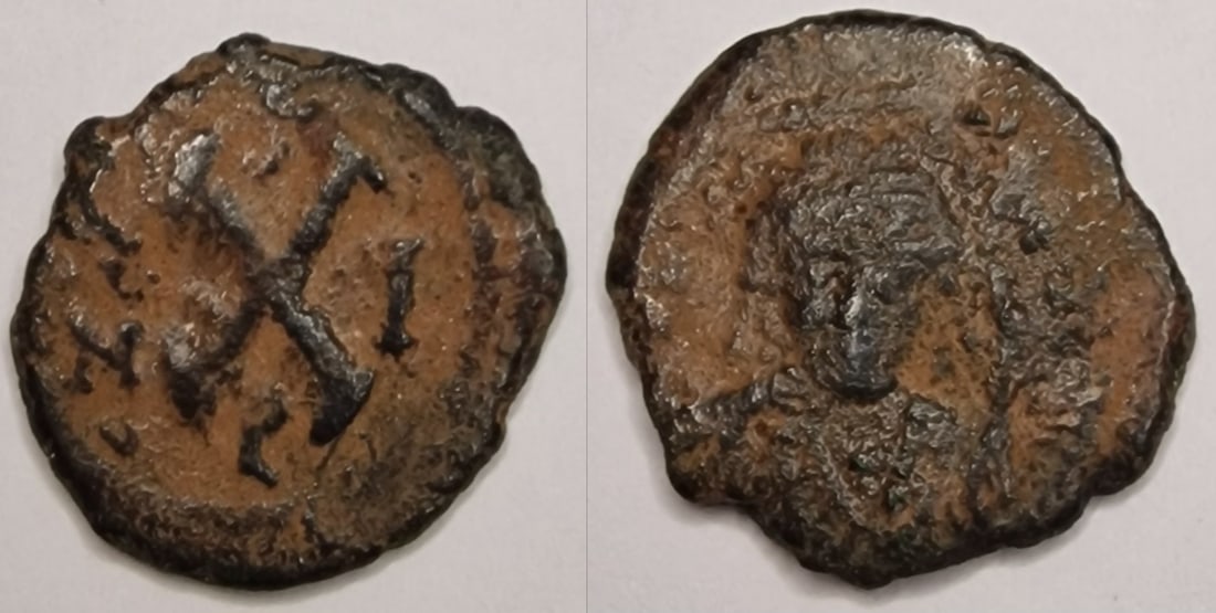 The Byzantine Empire: Title: The Byzantine Empire Description: Byzantine Empire. Maurice Tiberius (AD 582-602). AE Date/Period: AD 582-602 Materials: bronz coin Dimensions: 19.2 mm Reserve: $10.00 Shipping: Domestic: