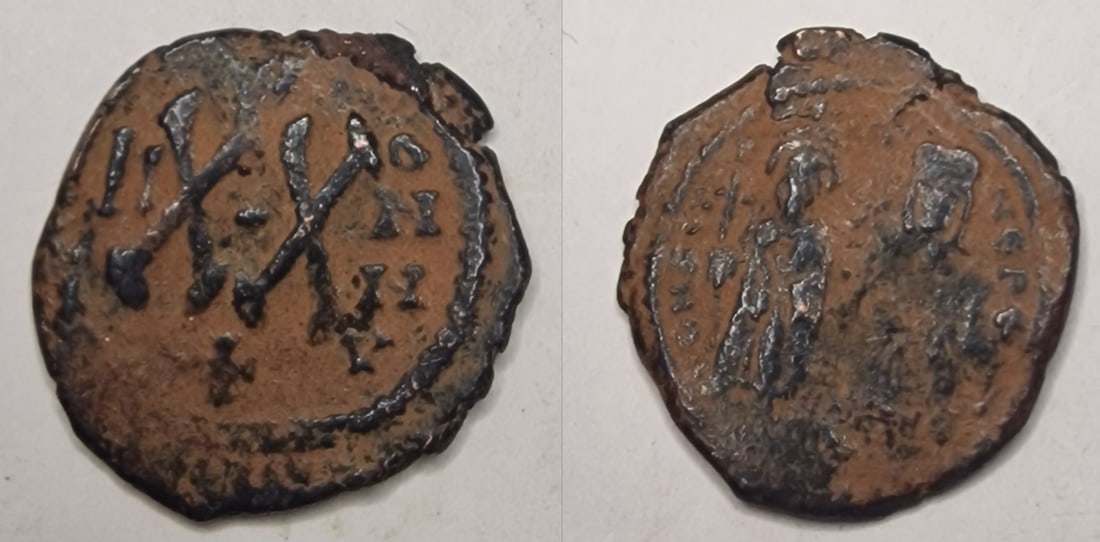 The Byzantine Empire: Title: The Byzantine Empire Description: Phocas, with Leontia, 602-610. Half Follis , uncertain northern Syrian mint, struck 615/616 under Persian rule. Phocas, holding globus cruciger, and Leontia, h