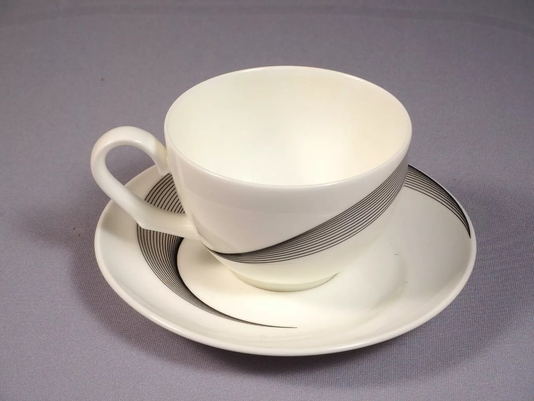 Wedgwood Apollo Coffee Tea cup Saucer Set Bone China Black White England: This vintage and beautiful set of one Coffee/Tea cup and a saucer. It is made by WEDGWOOD in beautiful Apollo pattern. According to the backstamp it was made between 1985 and 1992 The set features sno