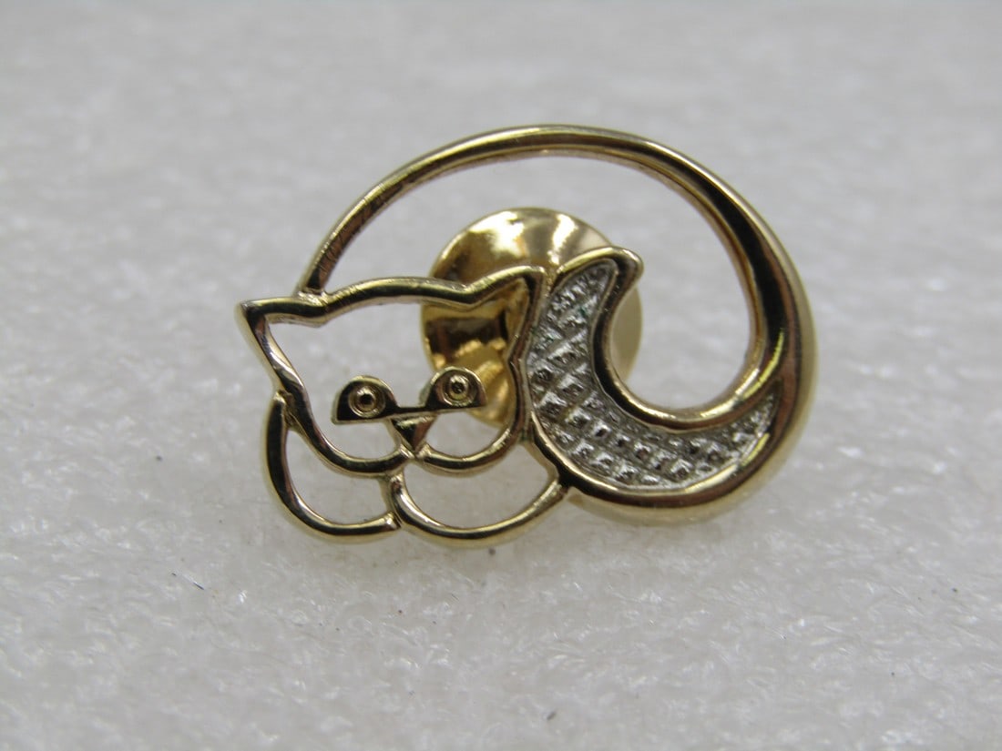 Vintage Two-tone Cat Tack PIn 1" Wide, 1980's: Vintage Two-tone Cat Tack PIn 1" Wide and 3/4" tall. A curled up kitty outline in gold tone with a silver tone tail. Signed Avon, 1980's. Very good condition - Nice as a tie tack too. (W51422.3 SS7290