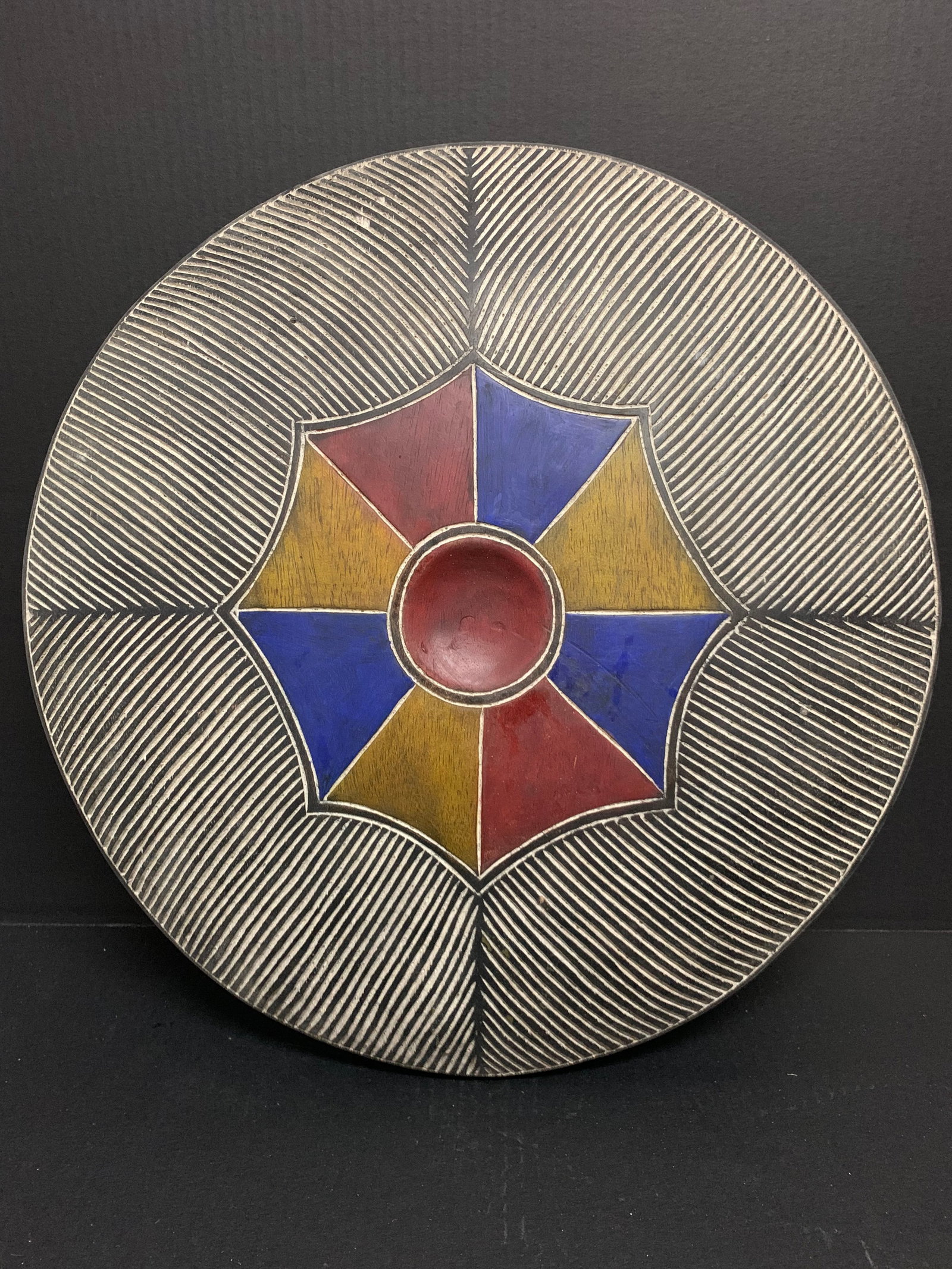 Zulu Shield: Title: Zulu Shield Date/Period: Late 20th Century Dimension: 21.5" h x 21" w Material: Wood Additional Information: African Tribal Art Zulu Shield Reserve: $95.00 Shipping: Domestic: Flat-rate of $40.