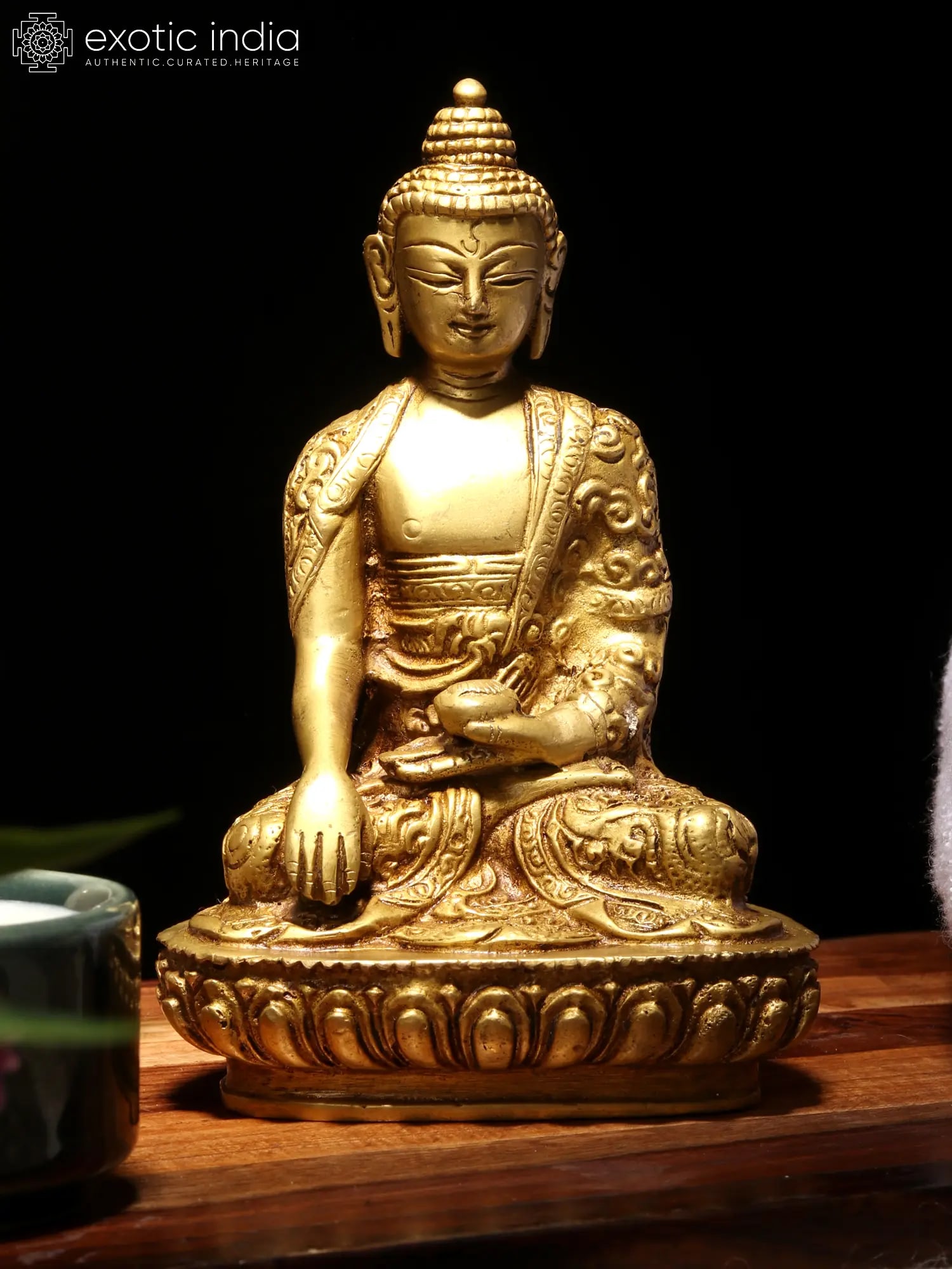 5" Small Bhumisparsha Buddha Adorned in a Designer Robe: Title: 5" Small Bhumisparsha Buddha Adorned in a Designer Robe Description: BRASS Height: 5 inch Width: 3 inch Depth: 3 inch Weight: 820 gm Reserve: $58.00 Shipping: Domestic: Shipping rates are deter
