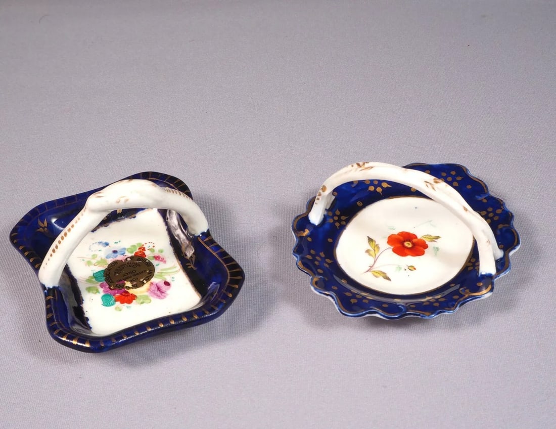 2 Antique Porcelain Cobalt Basket Tray Candy Nut Dish Set Handles Certified 1841: This is an exceptional Set of 2 (two) small Baskets/Nut Dishes/Trays. They are in cobalt blue and gold. One of them bears and British antique Dealers Association certifying that is made prior to 1841.