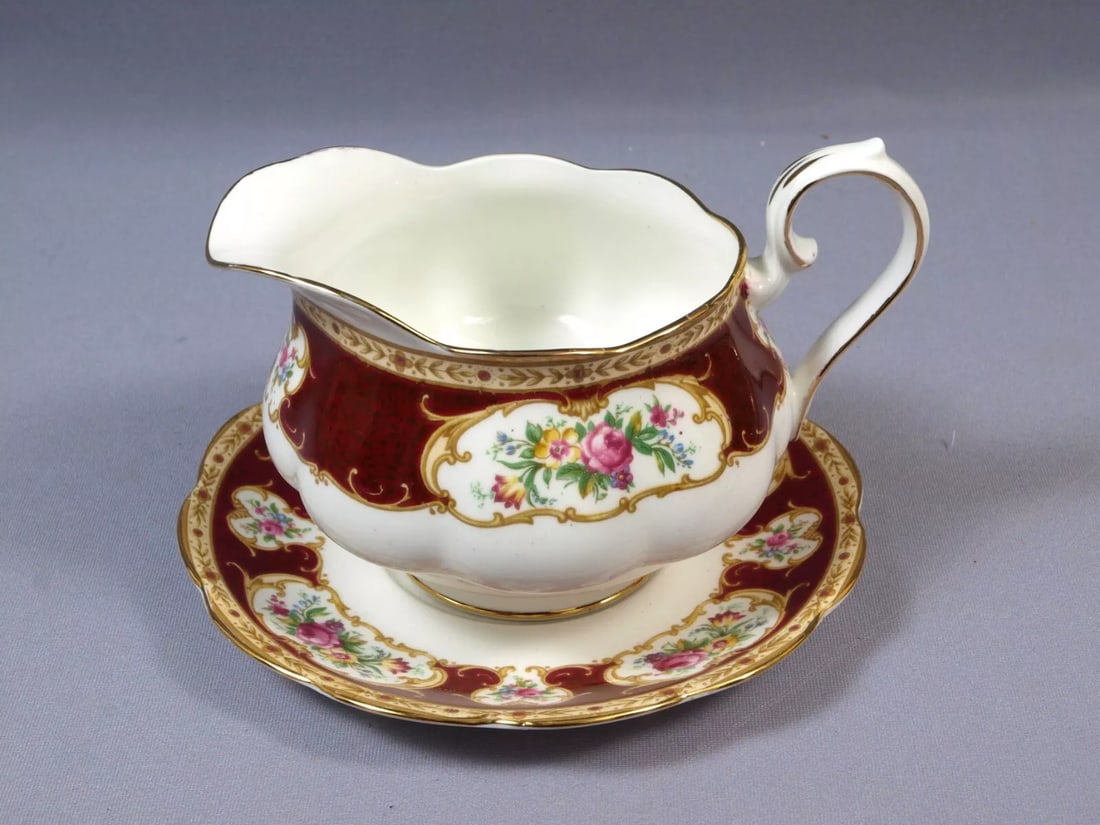 Royal Albert LADY HAMILTON Bone China Gravy Boat Sauce Under Plate England: This is a gorgeous Bone China Gravy/Sauce Boat with detached underplate. The set is made by Royal Albert in England. It is from Lady Hamilton pattern. It is properly marked with Royal Albert back stam