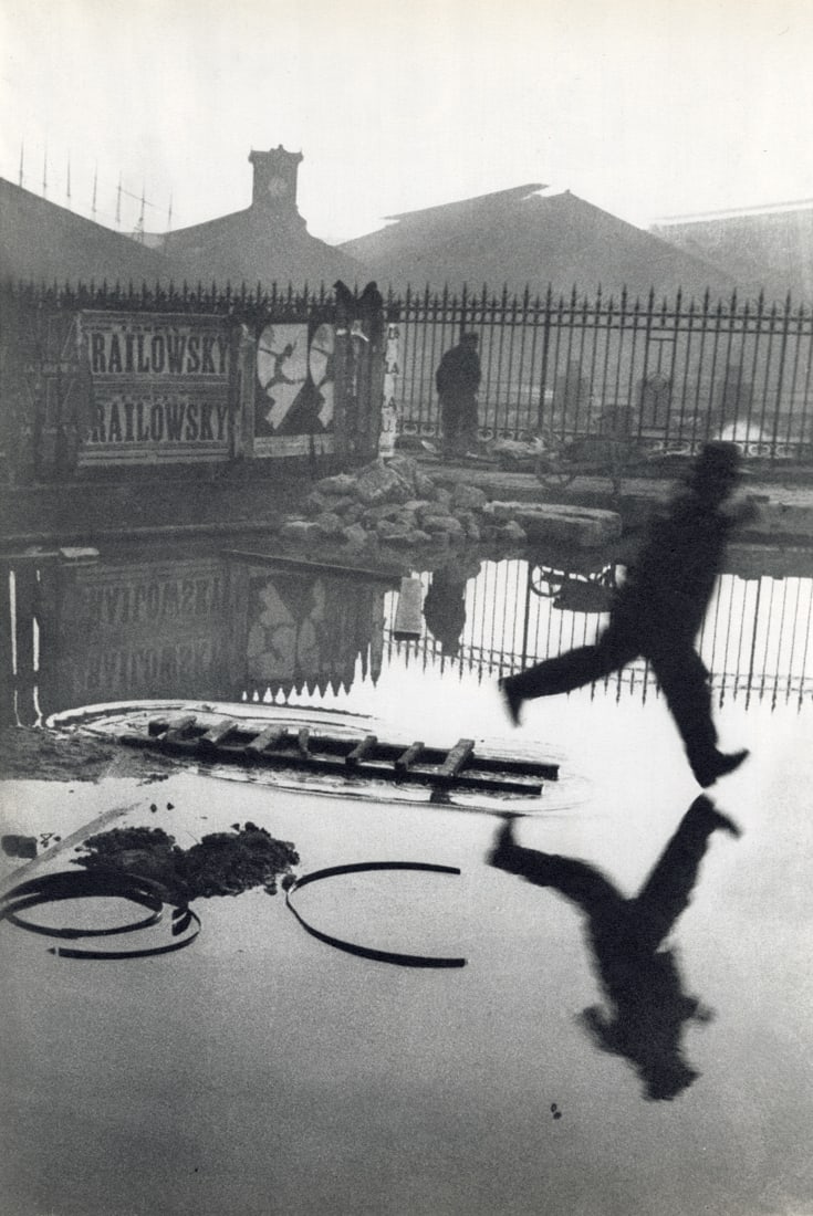 HENRI CARTIER-BRESSON - Behind the Gare, Paris, 1932: Artist: Henri Cartier-Bresson Title: Behind the Gare, Saint Lazare, Paris, 1932 Medium: Sheet Fed Gravure, 1952, France Dimensions: 9.05x13.55" Description: Heat Wax Mounted on 12x16" Conservation Boa