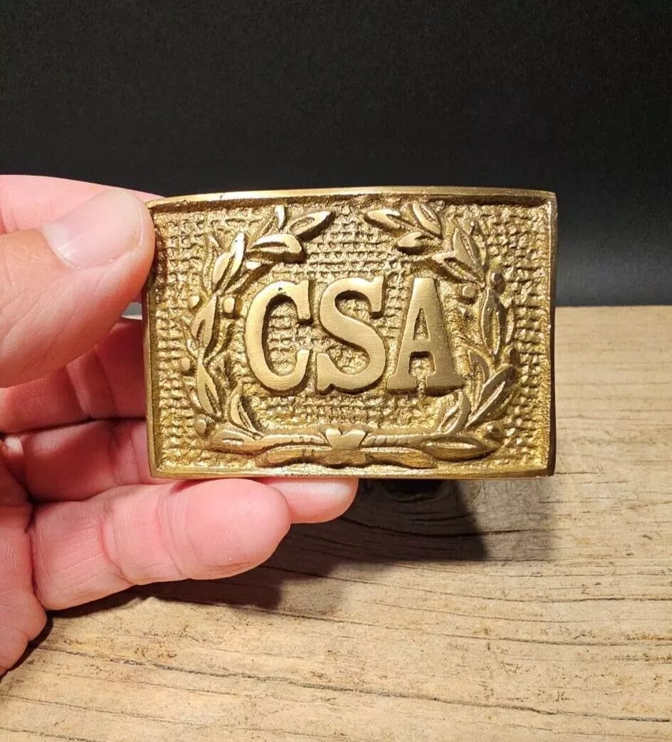 Military Civil War CSA Brass Belt Buckle: 3" long x 2 1/8" This all brass replica belt plate will surely make you wonder its age. It is made to look just like an antique The face of this plate has a very pleasing brown patina with slight trac
