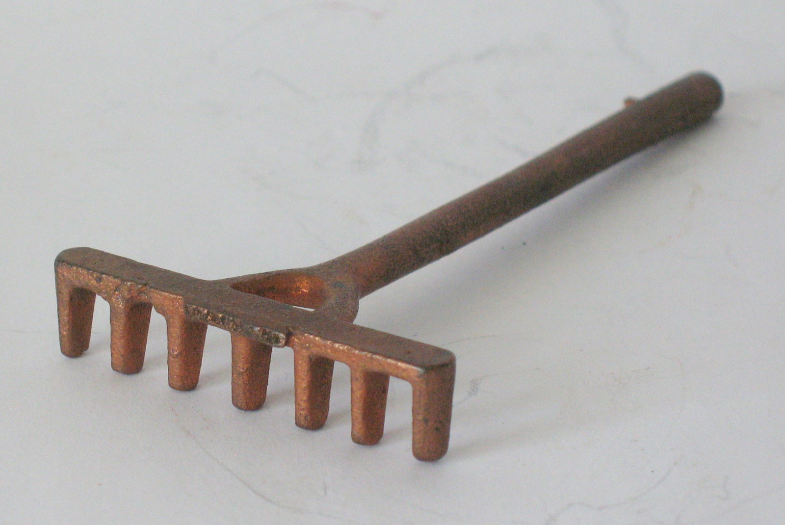 Vintage cast iron garden rake paper weight.: Title: Vintage cast iron garden rake paper weight. Date/Period: 1930's Dimension: 4” long Additional Information: Nice vintage cast iron garden rake paper weight in great original condition. Shi