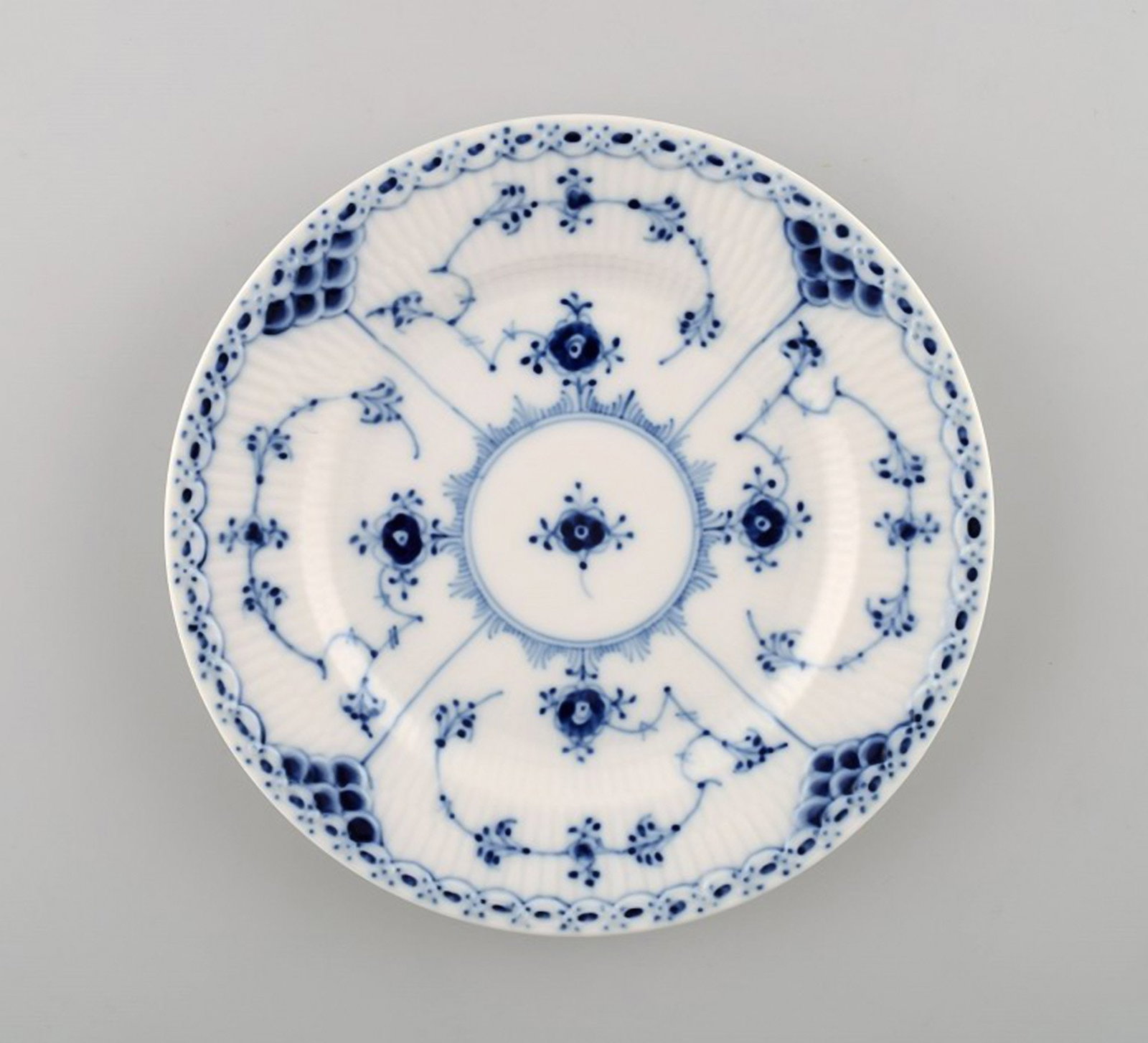 Royal Copenhagen Blue Fluted Half Lace Plate # 1/575.: Royal Copenhagen Blue Fluted Half Lace Plate # 1/575. 3 pieces in stock. Diameter: 15.5 cm. In perfect condition. 1st factory quality. Reserve: $25.00 Shipping: Domestic: Shipping rates are determined