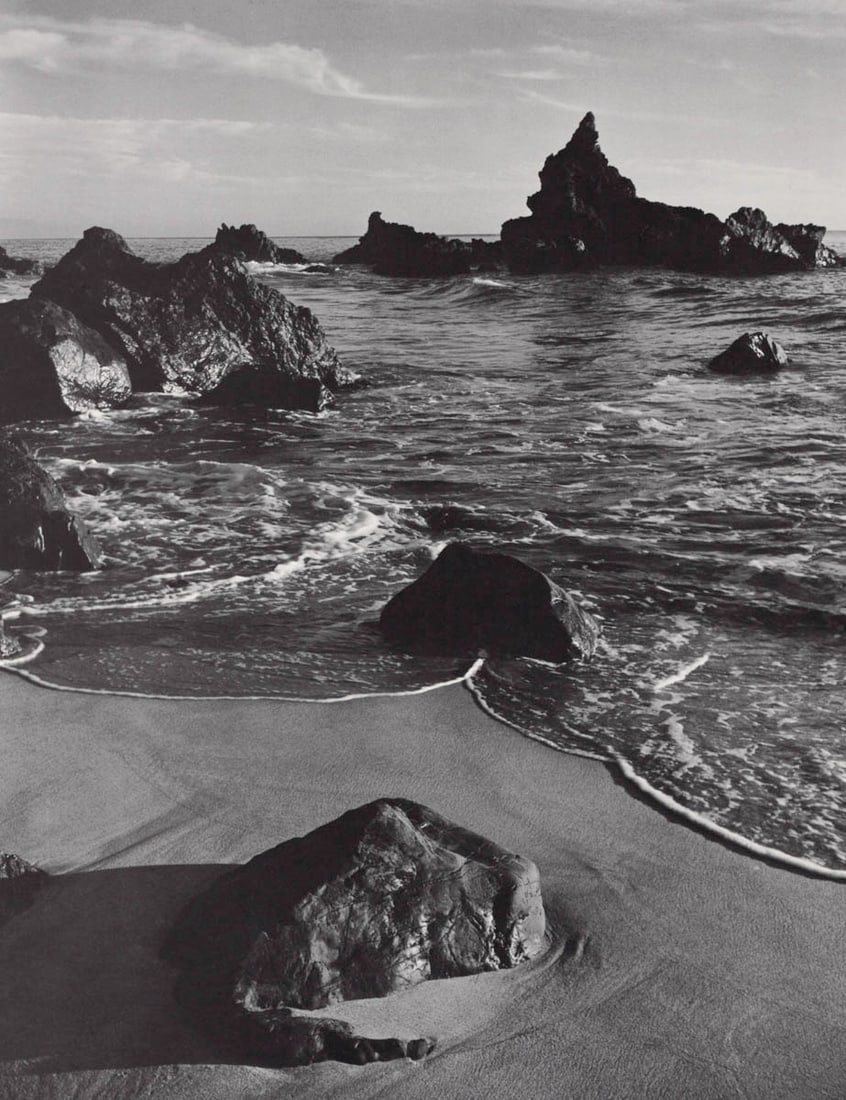 ANSEL ADAMS - Monterey County Coast, CA. c. 1951: Artist: ANSEL ADAMSPrint Title: Monterey County Coast, CA. c. 1951Medium: PhotolithographPrinted 1970’s in the USImage Size: approx. 11 x 8.5”Ansel Easton Adams(1902 – 1984),was an American 