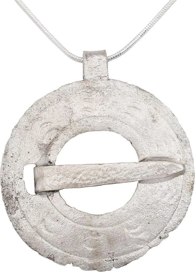 FINE VIKING PROTECTIVE BROOCH PENDANT NECKLACE: Circular bronze, over 1 1/2" diameter. Circular, slotted for the cross pin. Slightly domed and line-bordered with eight radial groups of three crescents, a reference to the moon worshiped as Mani, and