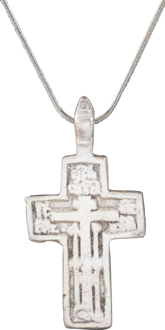 EASTERN EUROPEAN CHRISTIAN CROSS NECKLACE.: 17th-18th century, Polish, Russian or Ukrainian. Orthodox rite. Silvered bronze, over 1 1/2" height plus the elegant suspension loop. Relief decoration with raised borders and central cross surrounded