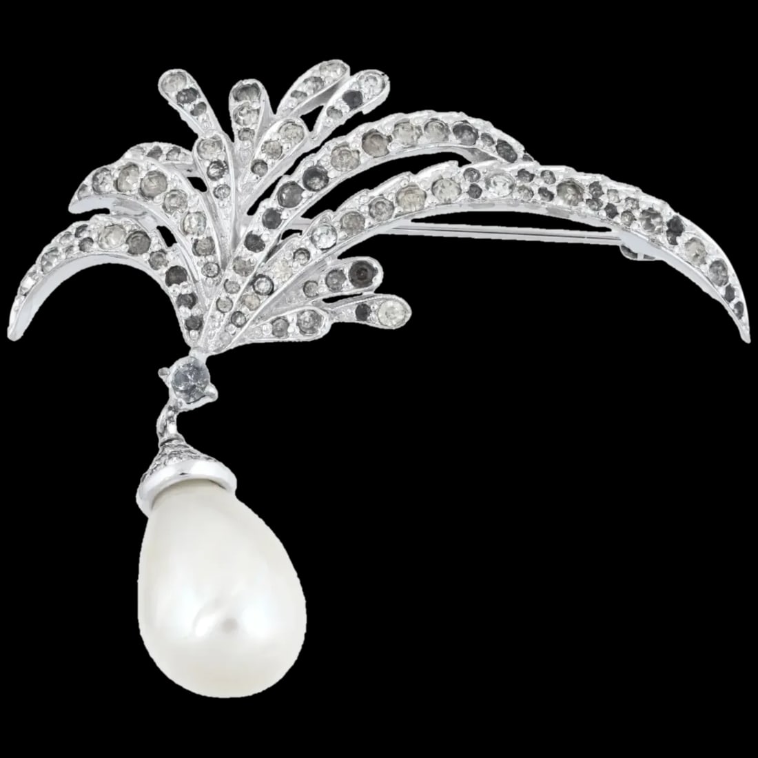 Vintage Jomaz Clear Rhinestone Pearl Pin Brooch: A vintage brooch by Jomaz, an American jewelry brand established by Joseph Mazer active in the mid-20th century. Silver-tone metal base set with clear rhinestones. Large freshwater pearl dangle. Marke