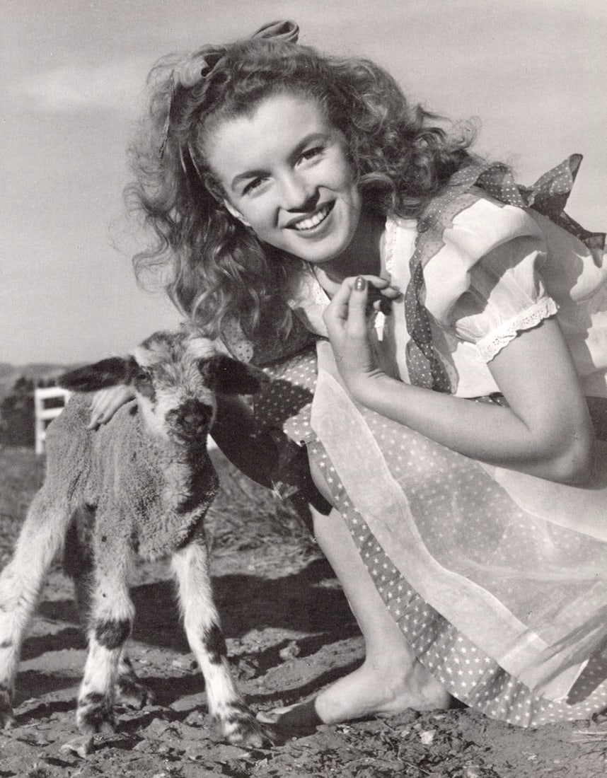 ANDRE DE DIENES - Marilyn Monroe (Norma Jean) (iwith goat): Artist: ANDRE DE DIENES Print Title: Marilyn Monroe (Norma Jean) Medium: Photo-lithograph Printed 1990’s in Singapore Image size (inches) approx. 12 x 9” Andre De Dienes De Dienes was a pr