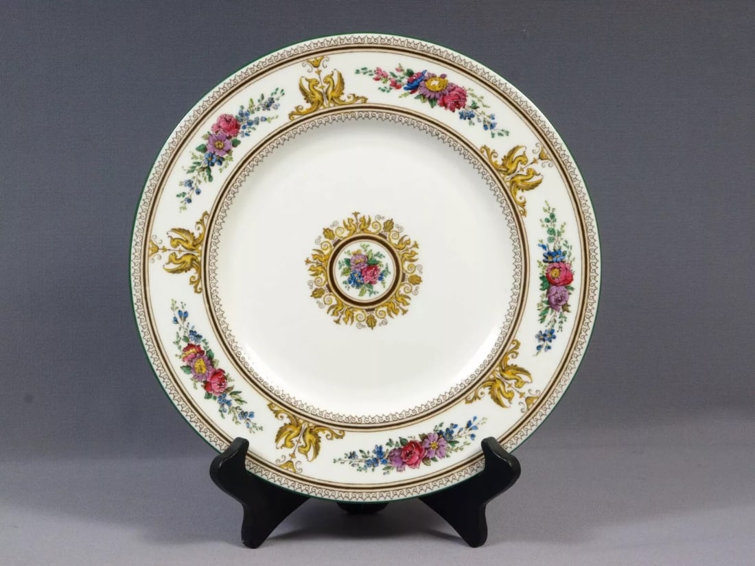 Wedgwood Columbia Dinner Plate Cup England Old mark: This is a very rare and beautiful DINNER PLATE made by WEDGWOOD in a Columbia pattern. This pattern was first introduced in 1924. It is characterized by an ornate border with flowers, yellow griffons 
