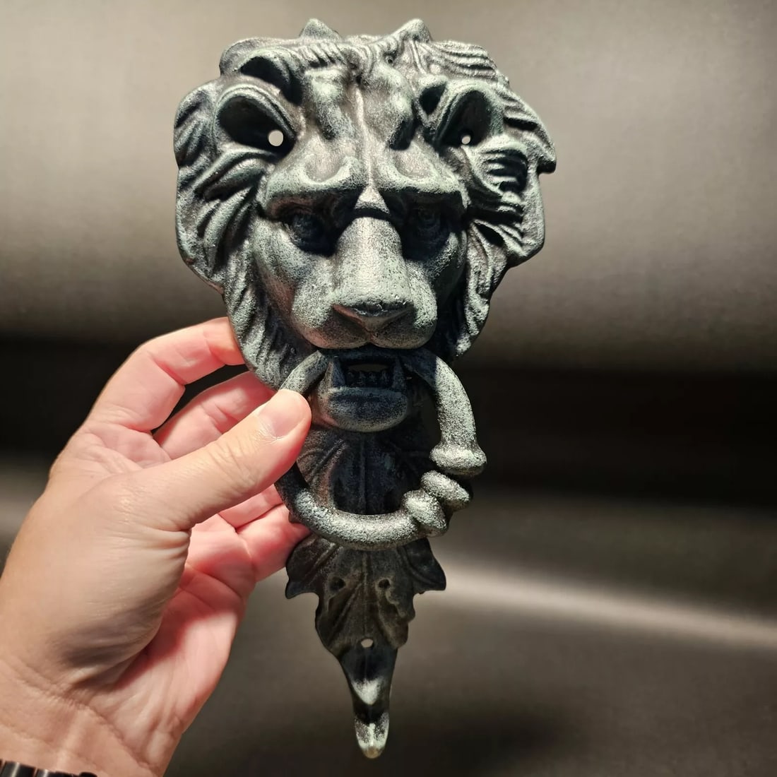 Cast Verdi Green Iron Lion Door Knocker w Hook: 10 3/4" Tall x 5 1/4" wide 2 lbs 7oz Nice heavy quality reproduction cast iron door knocker! As you can see this is a solid lion face door knocker. The ring in the lions mouth serves as the knocker. N