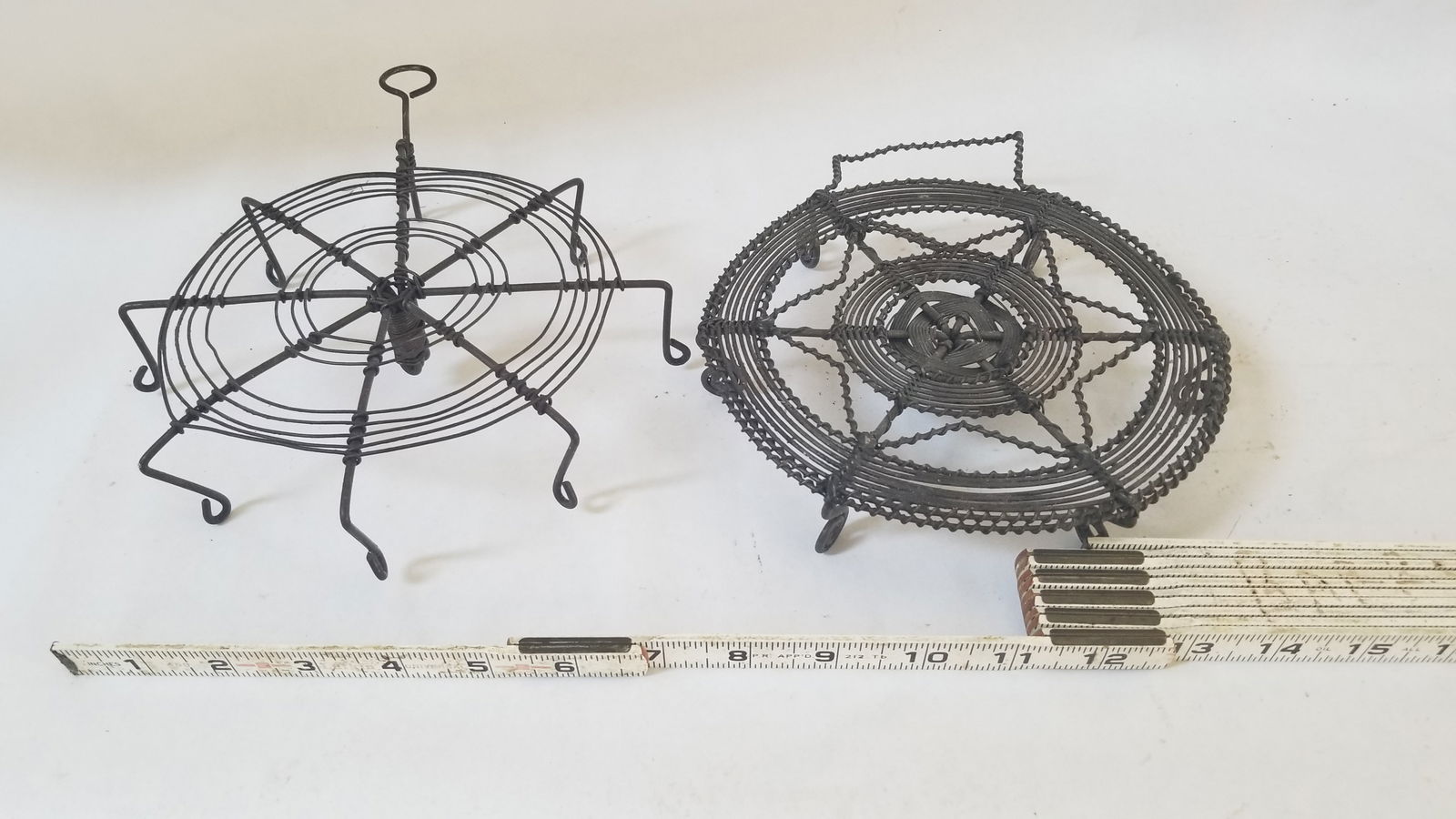 Two wire trivets 19th century: about 7" each Shipping: Domestic: Flat-rate of $15.00 to anywhere within the contiguous U.S. International: Foreign shipping rates are determined by destination. International shipping may be subject