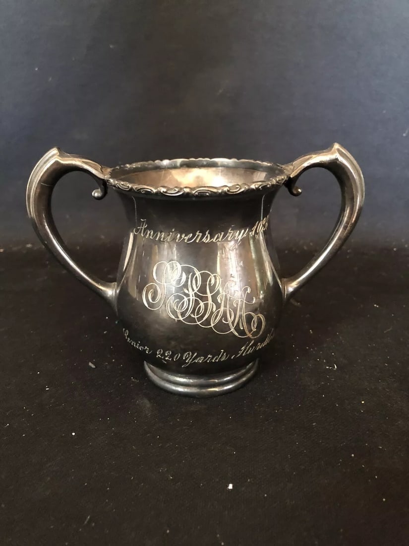 1928 4 1/4” Senior 200 Yd Hurdles Loving Cup Trophy: It measures 4 1/4” x 6” and is dated 1923. It has wear as shown in the photos Shipping: Domestic: Flat-rate of $10.00 to anywhere within the contiguous U.S. International: Foreign shipping