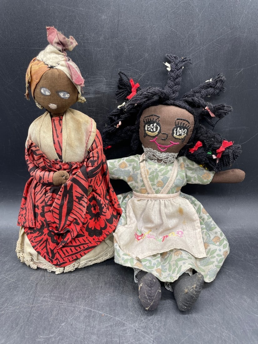 Pair of Black Americana Dolls: Title: Pair of Black Americana Dolls Date/Period: unknown Dimension: one approx 10" and the other approx 7.5 Material: cloth and one has a straw bottom Additional Information: Pair of Black Americana