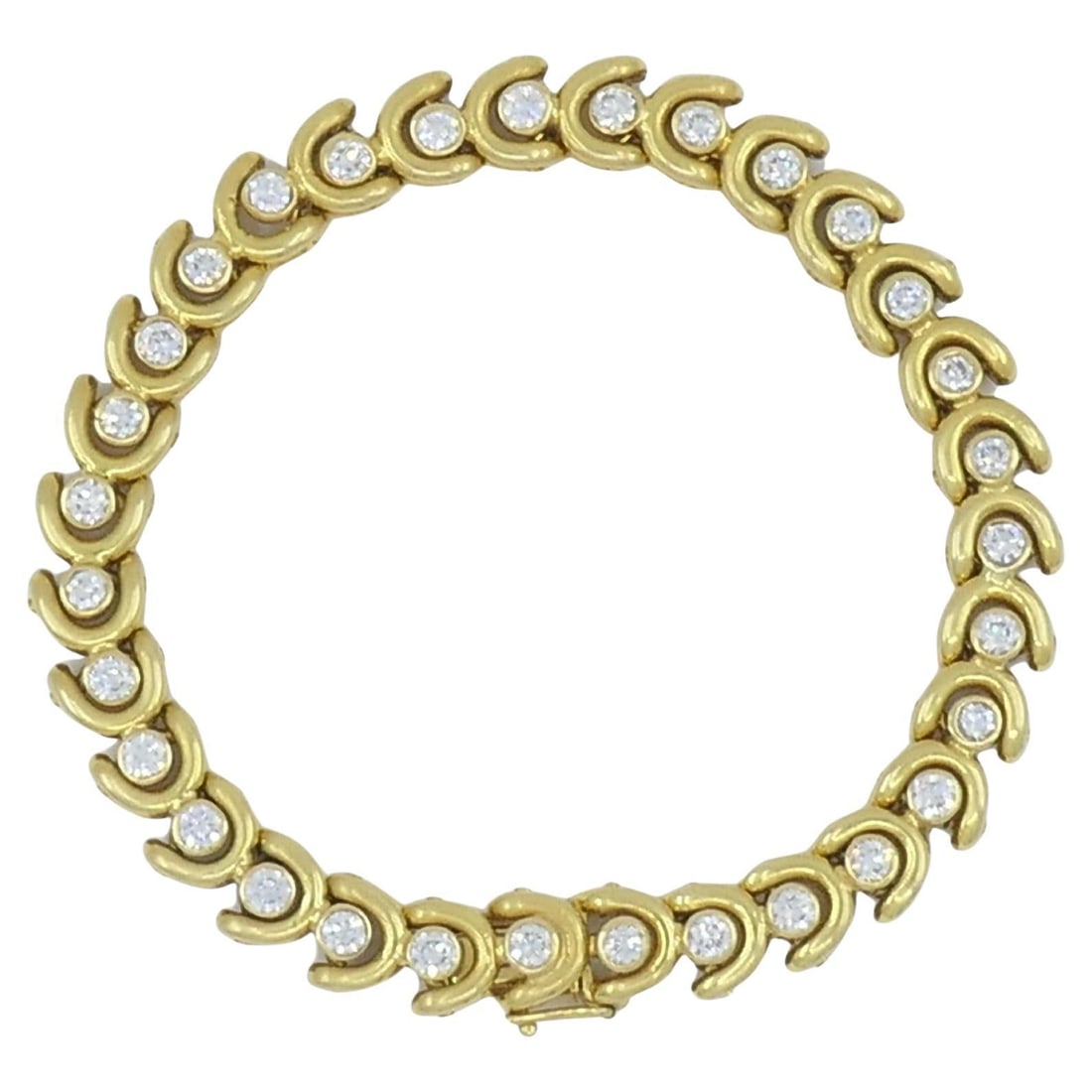 Van Cleef & Arpels Bracelet 18k Gold Diamond: About the Item A beautiful Van Cleef & Arpels bracelet, crafted of 18k gold, featuring bezel set diamonds. Each link is accented with a sparkling gem, creating a continuous, fluid pattern that catches