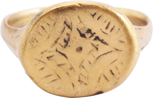 MEDIEVAL CHRISTIAN RING, 9TH-12TH CENTURY AD, SIZE 8 ¾-9: The Viking period through early Crusades. Gilt bronze, size 8 ¾-9, oval form. Rounded face 2.6mm width band. The shoulders are flared and transitioned to ridges. Oval bezel with rounded edge. The