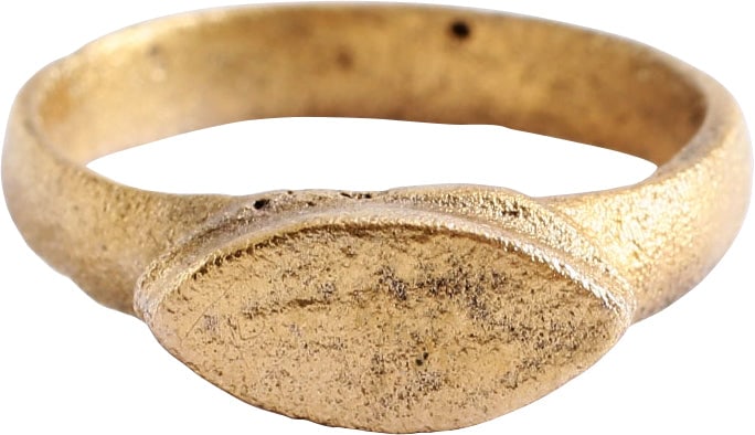 ROMAN MYSTICAL RING, 3RD-5TH CENTURY AD, SIZE 6: Gilt bronze. Size 6 with 3.4mm well rounded face band. Raised stepped lenticular bezel with an elongated V, probably an abstracted version of the squinting eye or evil eye. Intended to protect the wea