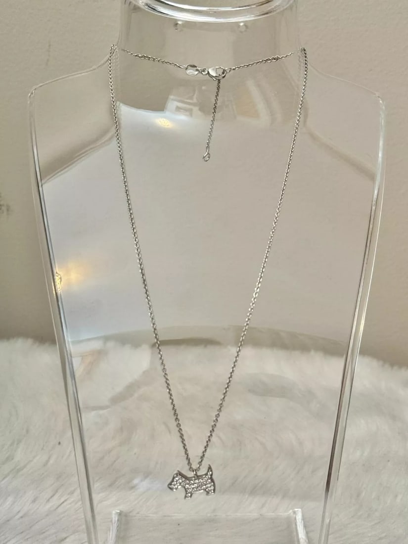 Crivelli Italy Diamond & 18K White Gold Dog Pendant Charm: Beautiful Crivelli diamond & 18K white gold dog pendant charm featuring cute design with diamond accents. Reserve: $1,200.00 Shipping: Domestic: Flat-rate of $50.00 to anywhere within the contiguous U