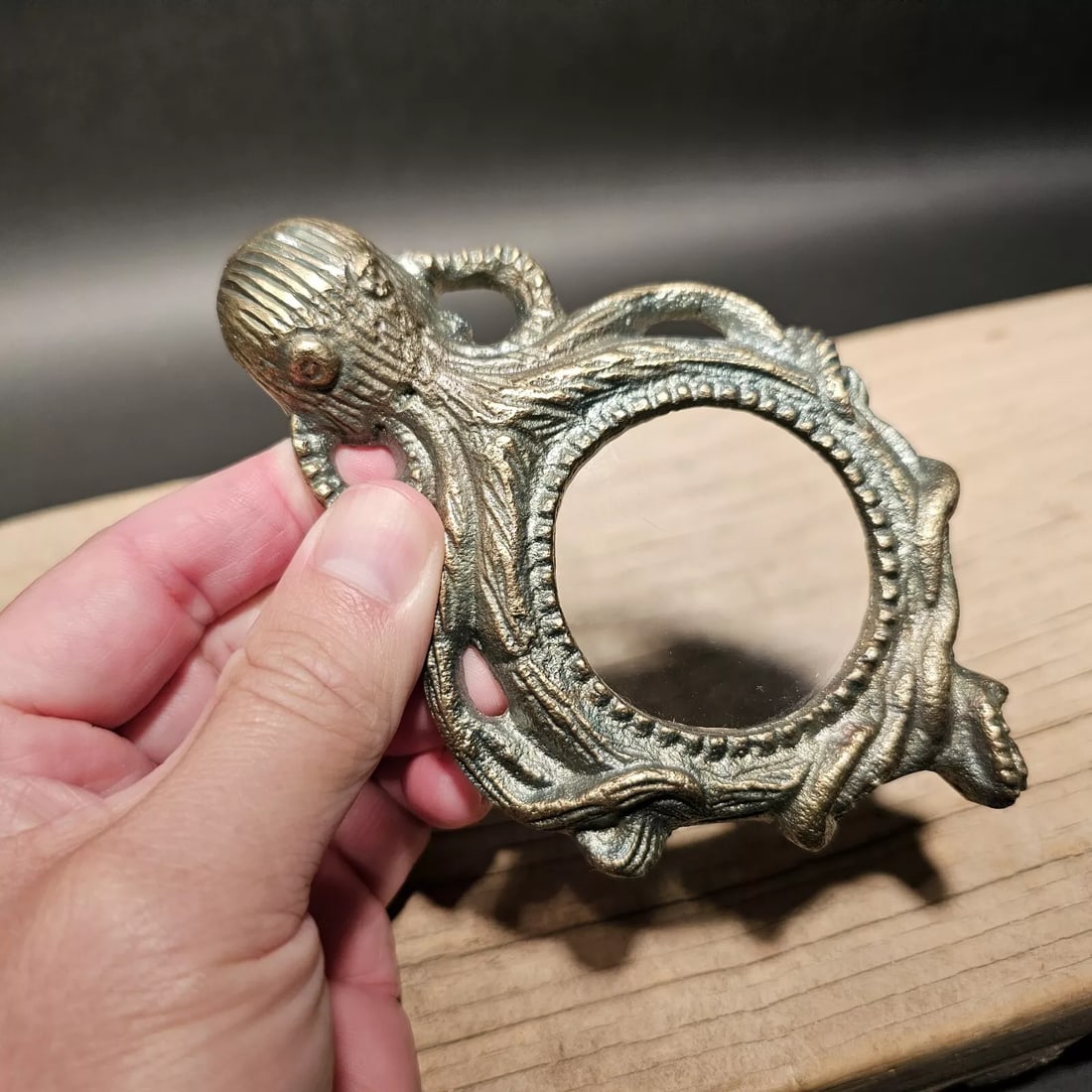 5 1/2" Brass Octopus Magnifying Glass Desk Hand Lens: The 5 1/2" long x 3 1/4" wide glass reproduction of an antique magnifying glass is a stunning piece that harks back to the 18th and 19th centuries. During this era, magnifying glasses were essential t