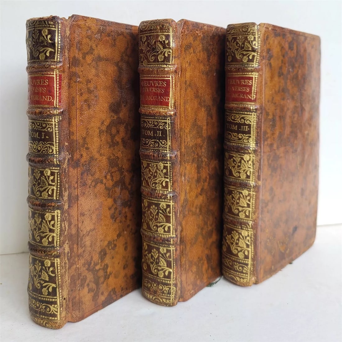 1751 FRENCH THEATER 3 VOLS antique Theatre et oeuvres diverses by P. MORAND: Morand,P.de Theatre et oeuvres diverses. 3 vols. Paris, Jorry ; 1751 Decorative marbled leather volumes Spines with raised bands, decorated in gilt Red edges, marbled endpapers Clean, very good interi