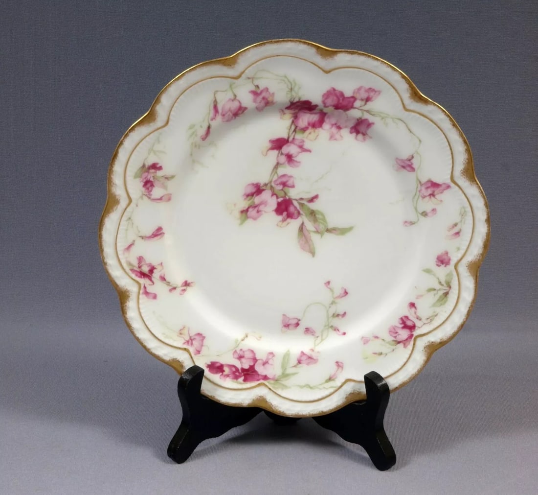 Limoges France HAVILAND Salad Plate Bowl J.J.Harte Amsterdam Pink Iris Sweet Pea: This is a rare and gorgeous Luncheon/Salad Plate, made in Limoges, France by Theodore Haviland. The plate is made explicitly for J. J. Harte. It has pink flowers and vines. The plate is 8 5/8" in diam