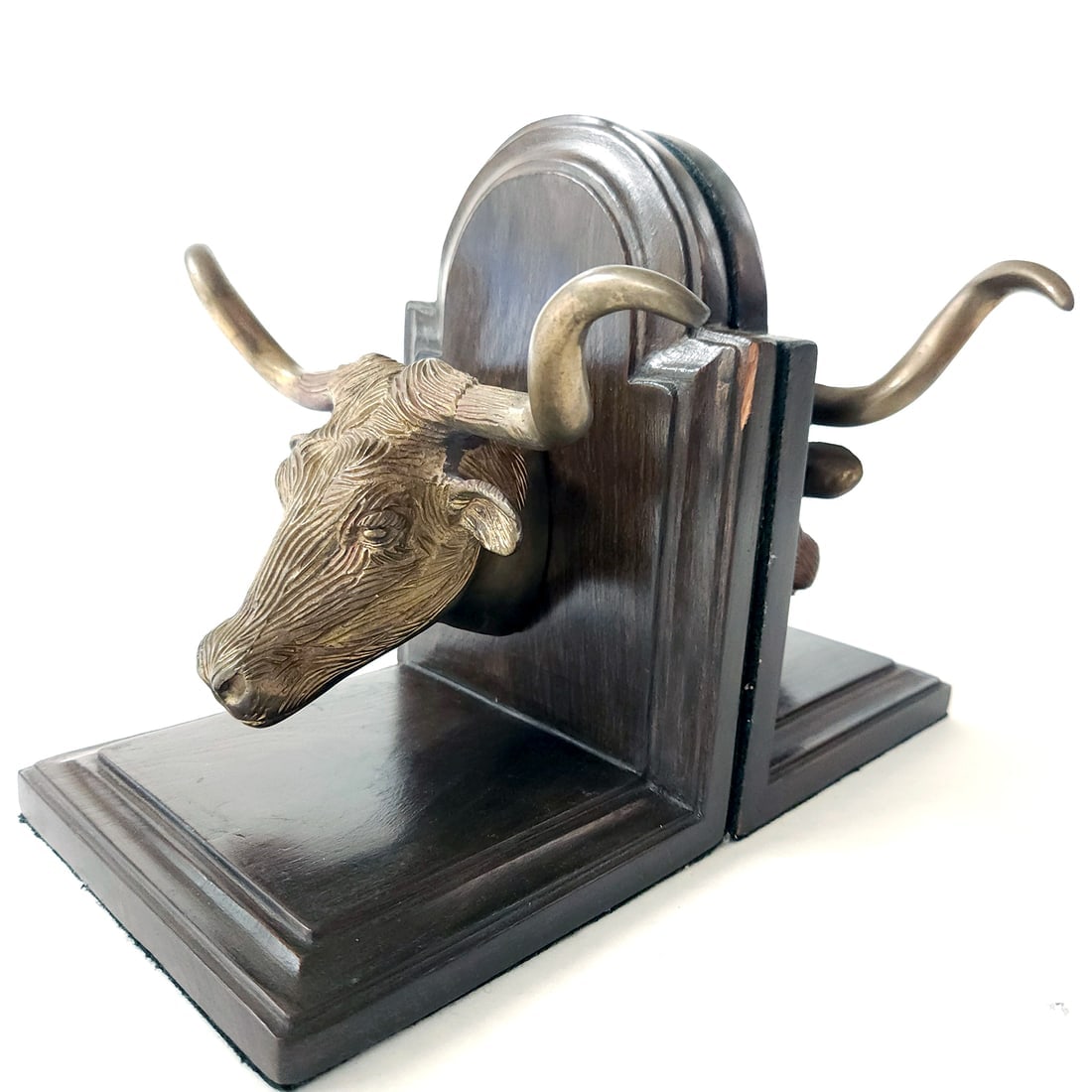 Longhorn Bronze and Wood Bookends: Title: Longhorn Bronze and Wood Bookends Provenance/Additional Info: Longhorn Bronze and Wood Bookends Materials: Lovely pair of bronze longhorn cattle mounted on a dark wood bookend. Has dark green c