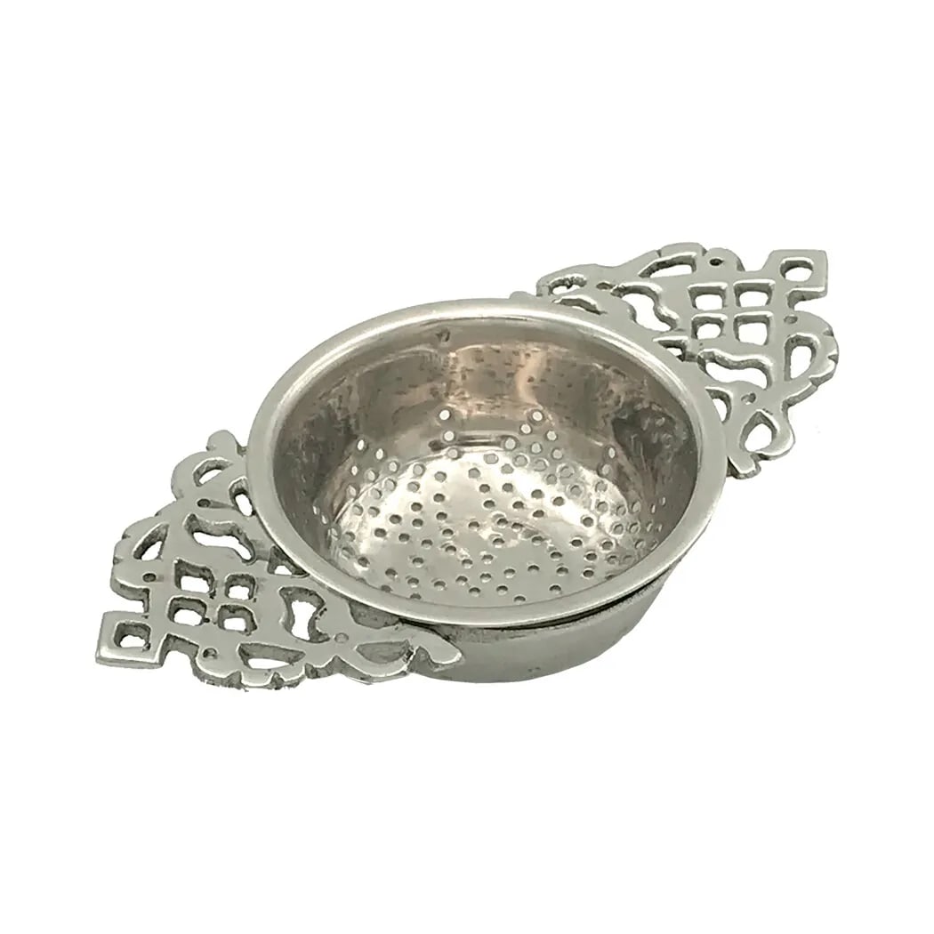 4-1/2" Tea Strainer: 4 inches long, 2-1/2 inches wide, and 3/4 inches high Strain your tea in style using our elegant reproduction tea strainer. It's made of silver plated brass with beautifully detailed handles. A perfec